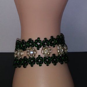 Handmade bracelet with green and white beads.